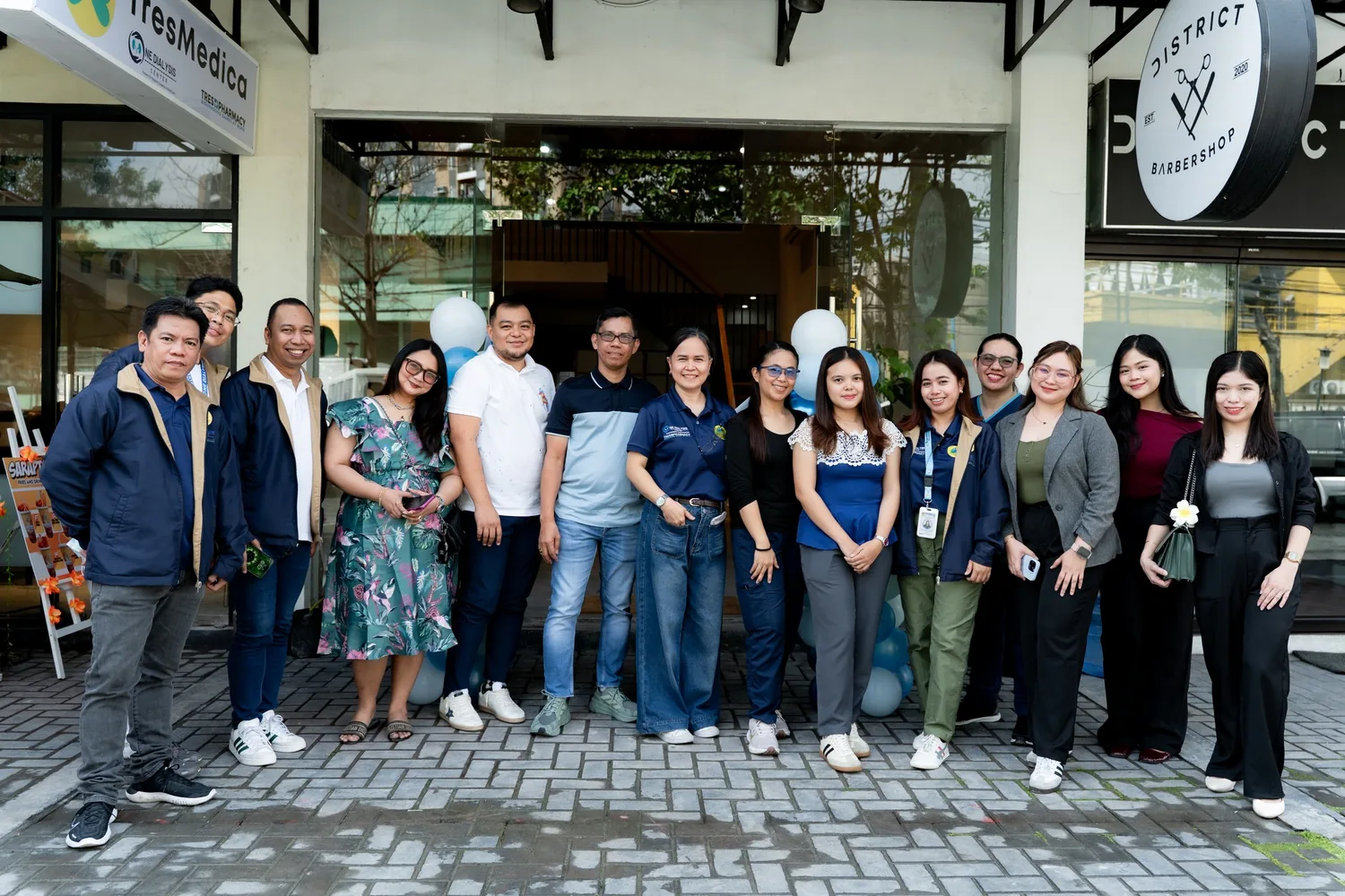 The TresMedica team outside the head office